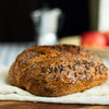 Classic sourdough bread on a wooden board with a blurred background