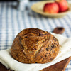 Classic sourdough bread on a wooden board with a blurred background