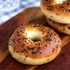 Bagels with sesame seeds on a wooden surface