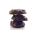 Stack of NYC Chocolate Almond Praline cookies against a white background
